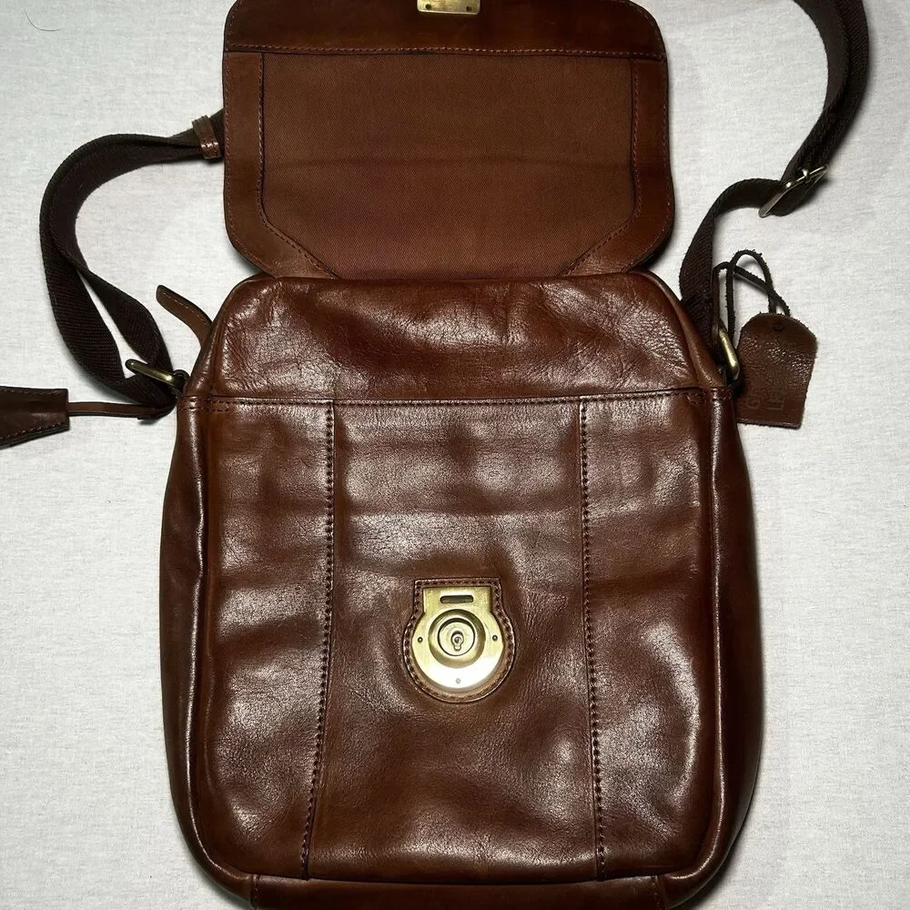 brown genuine leather crossbody bag features a lockable front flap closure